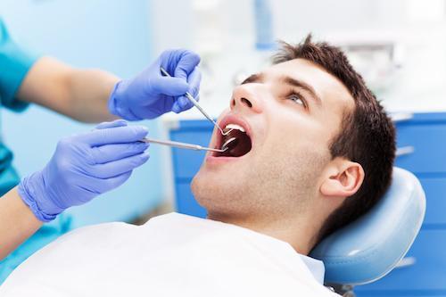 Patient receiving a dental exam and cleaning in Beachwood, OH